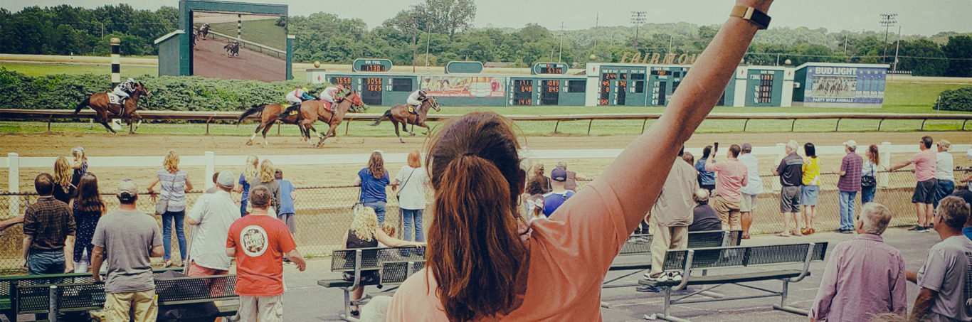 Women cheering at race track